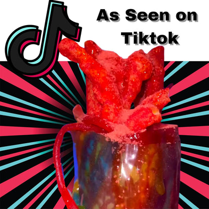 Red candy sculpture in a glass with TikTok logo and text 'As Seen on Tiktok' on a colorful background